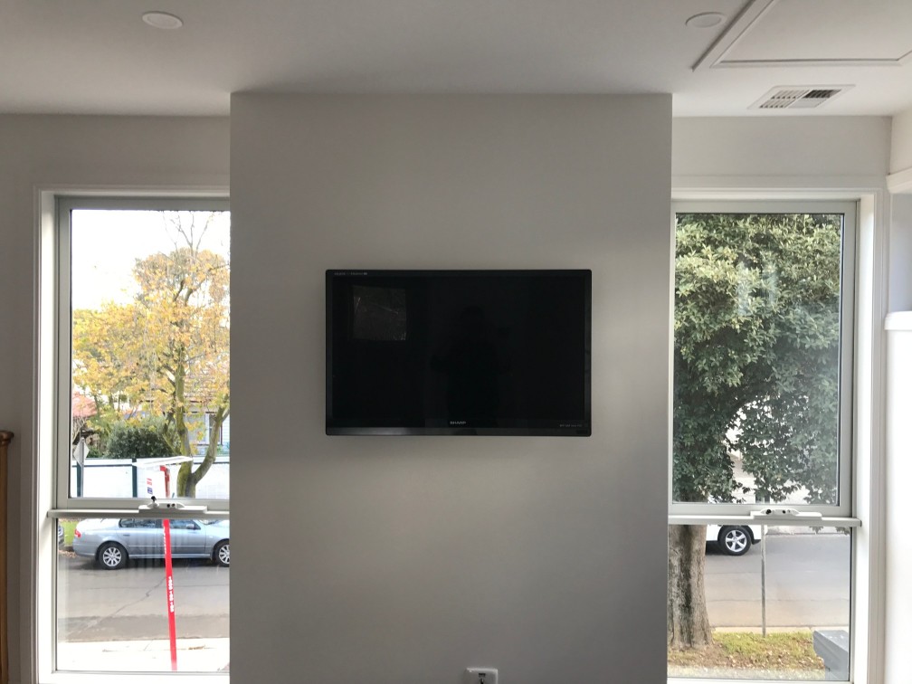 Wall Mounted TV by Jim's Antennas