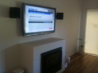 Speakers and Wall Mounted TV by Jim's Antennas